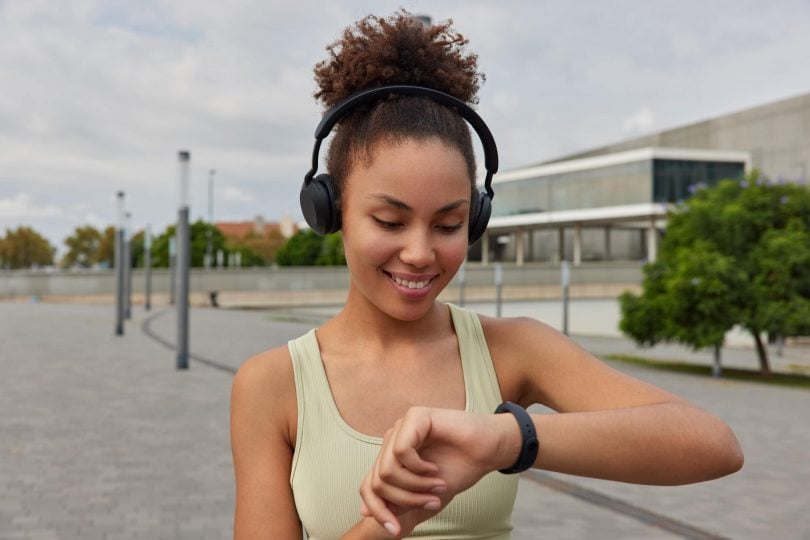 Fitness girl looking to apple watch