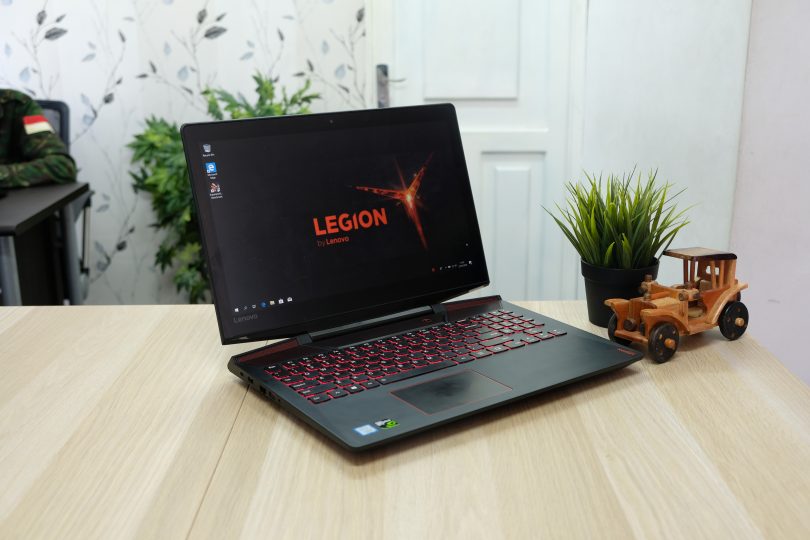 lenovo legion gaming laptop sitting on a wooden desk