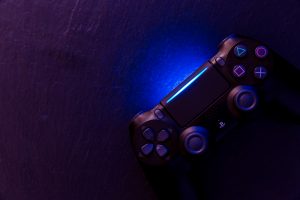 playstation controller glowing blue on table