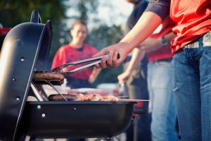 friends enjoying a barbecue outside