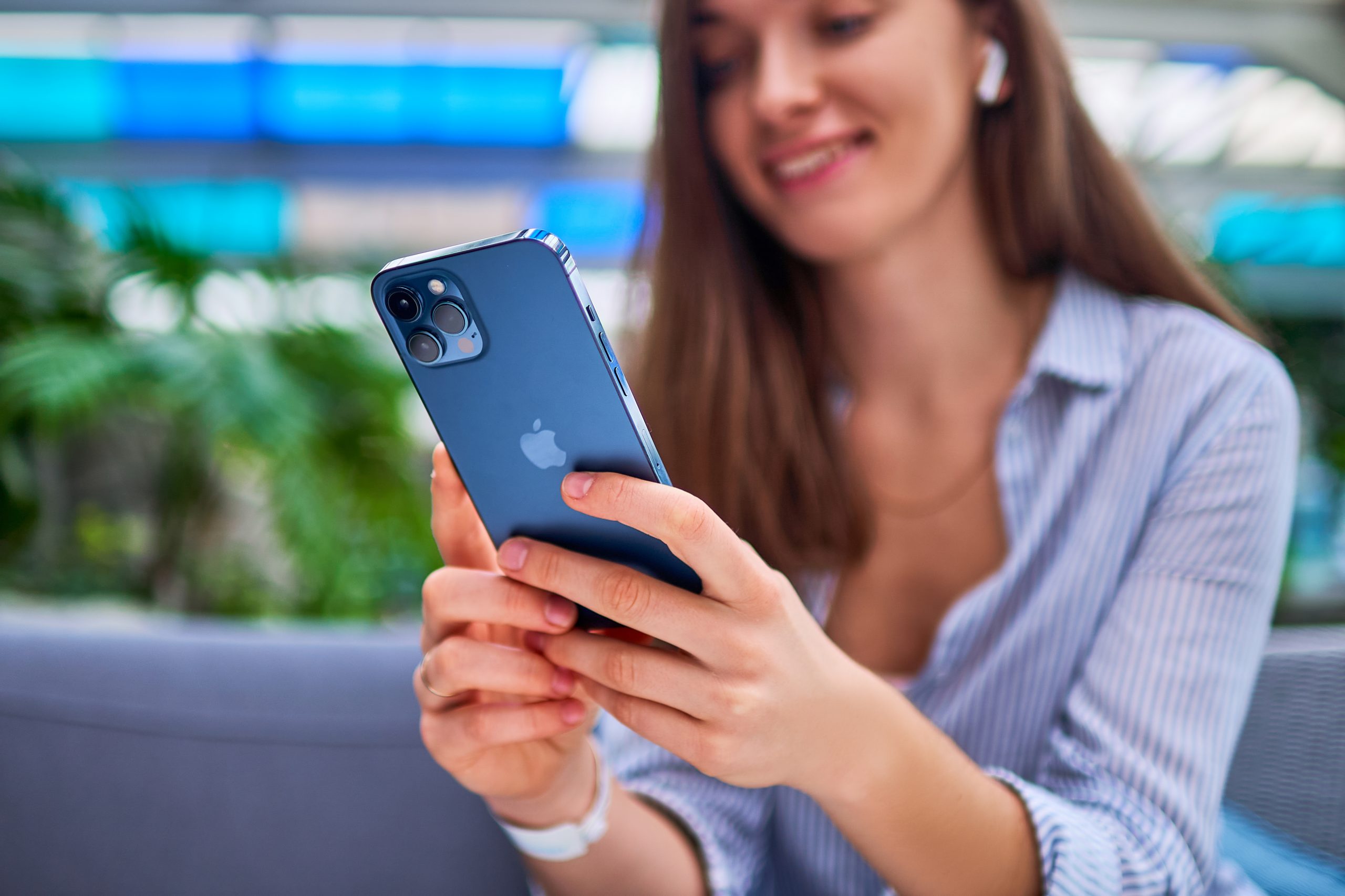 young woman using latest iphone