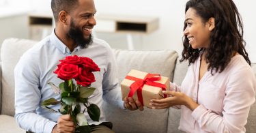 husband giving wife a present on valentine's day
