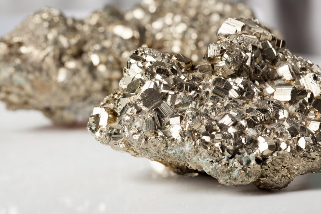 Closeup of 2 sparkling chunks of raw gold