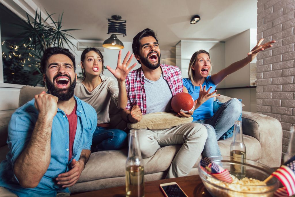 A group of friends watching the Super bowl together