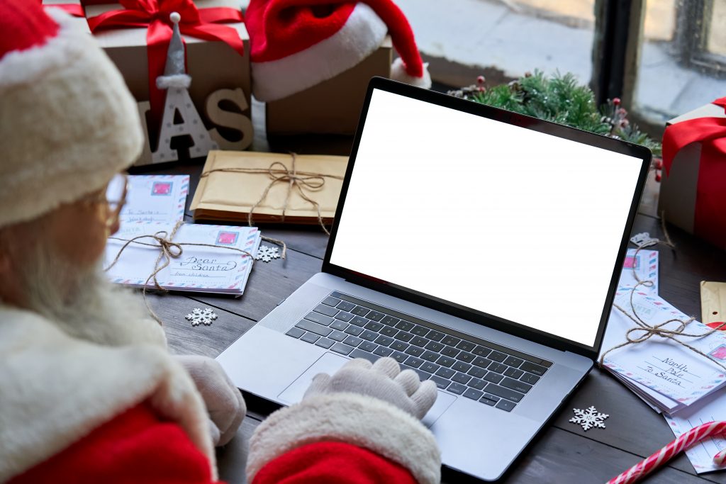 Santa at his desk with his tablet
